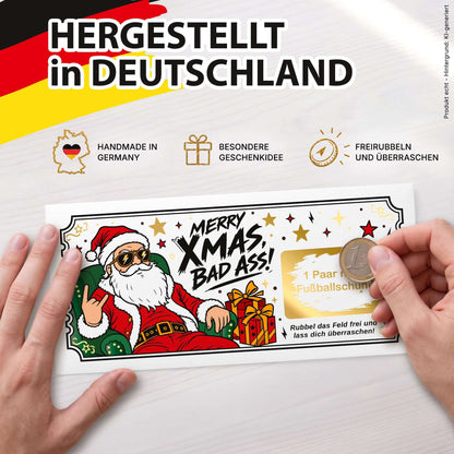 Rubbelkarte Merry Xmas Bad Ass wird mit einer Münze freigerubbelt – hergestellt in Deutschland – KuschelICH
