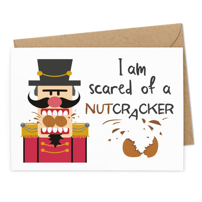 Lustige Weihnachtskarte "Scared of a Nutcracker" - Ansicht Vorderseite - Nussknacker zerbeisst 2 Nüsse