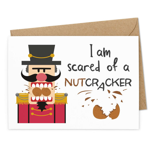 Lustige Weihnachtskarte "Scared of a Nutcracker" - Ansicht Vorderseite - Nussknacker zerbeisst 2 Nüsse